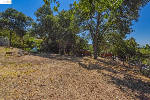 an aerial view of multiple houses with yard