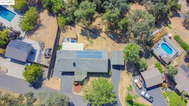 aerial view of a house with a yard