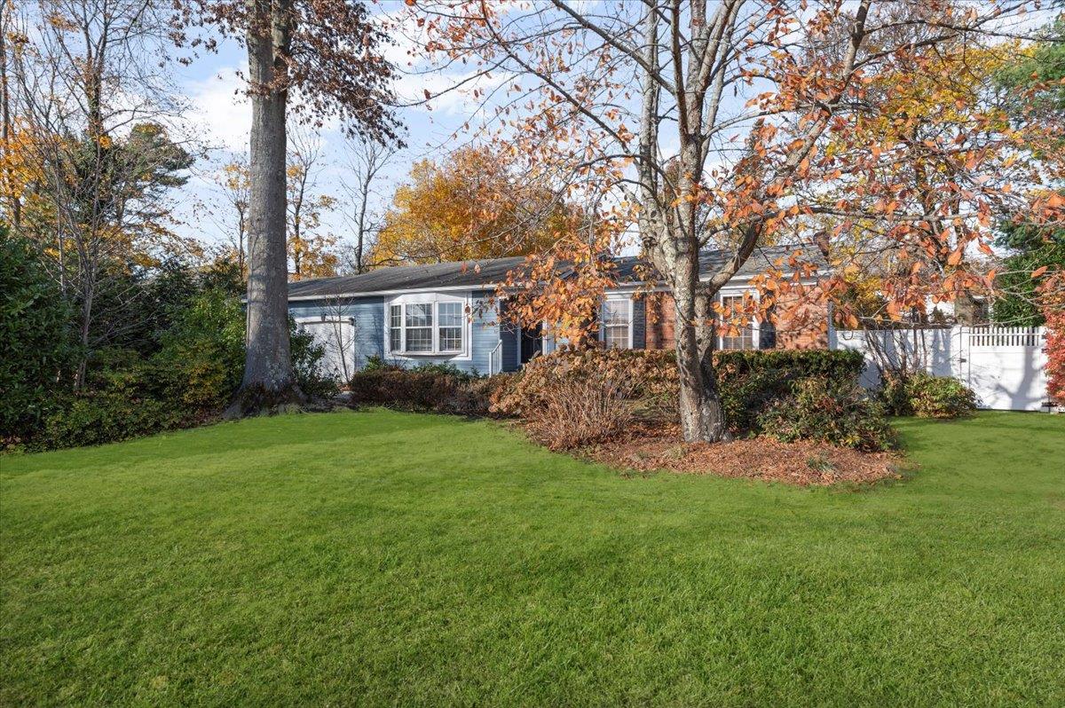93 Ridgeway Avenue Setauket, NY 11733 - Photo 1 of 1 View of front facade with a front lawn