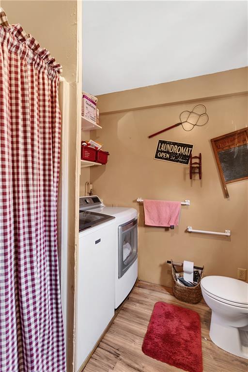 23-25 Locust Street Uniontown, PA 15401 - Photo 15 of 23 a bathroom with a toilet a sink and vanity