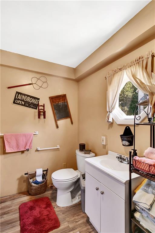 23-25 Locust Street Uniontown, PA 15401 - Photo 16 of 23 a bathroom with a toilet sink and mirror