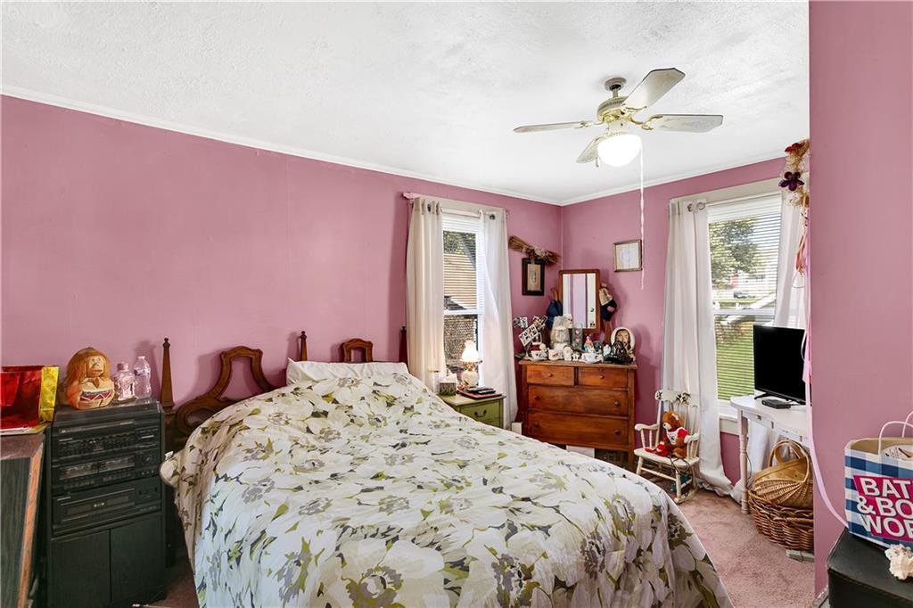 23-25 Locust Street Uniontown, PA 15401 - Photo 20 of 23 a bedroom with a bed and a flat screen tv