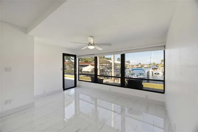 a view of empty room with window and window