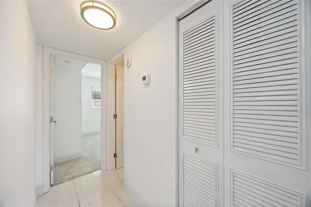 a view of a house with backyard porch and sitting area