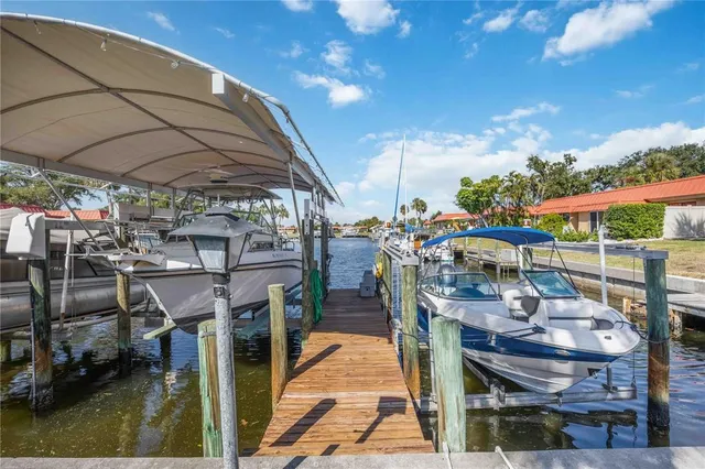 a kitchen with stainless steel appliances a refrigerator sink and stove