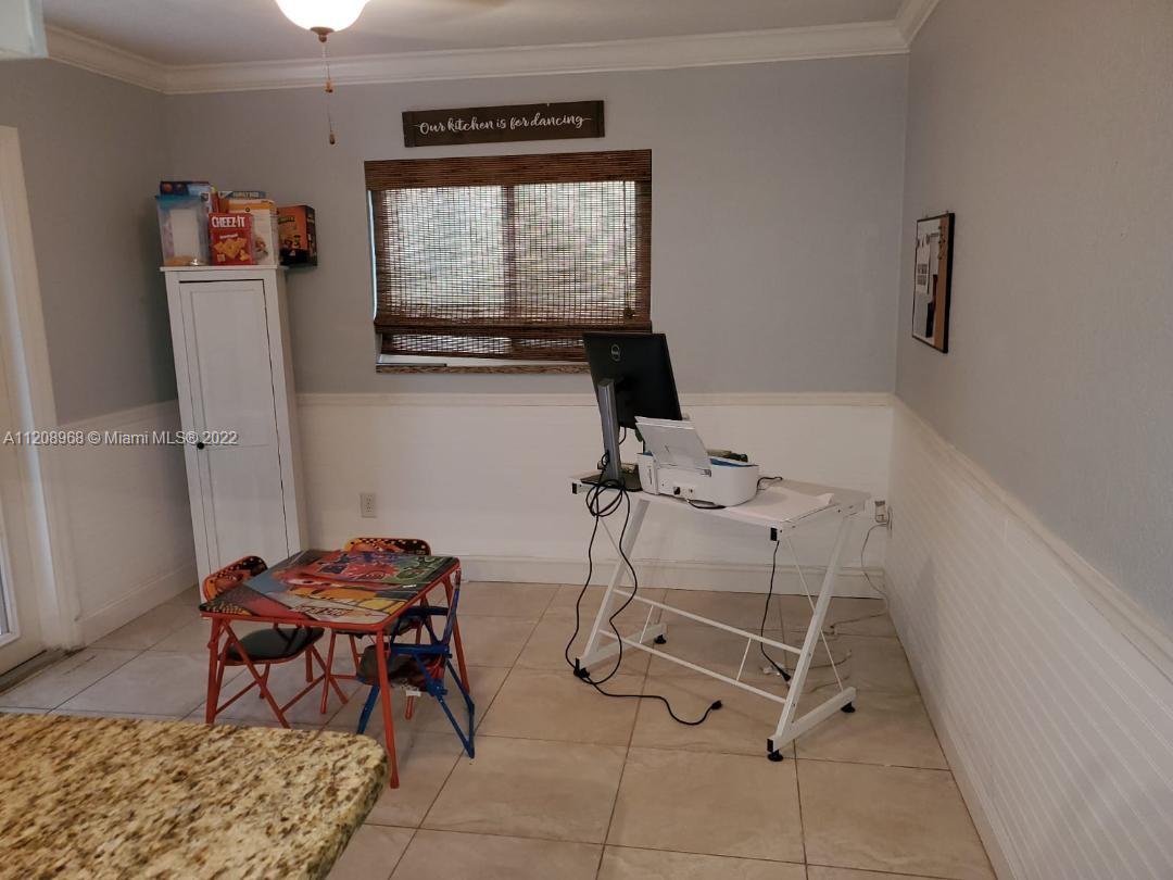 10650 Eland Street Boca Raton, FL 33428 - Photo 7 of 17 a room with furniture and a window