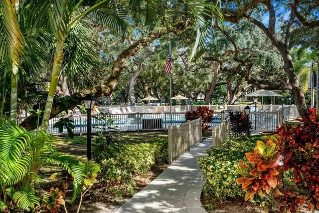 a view of a backyard with sitting area