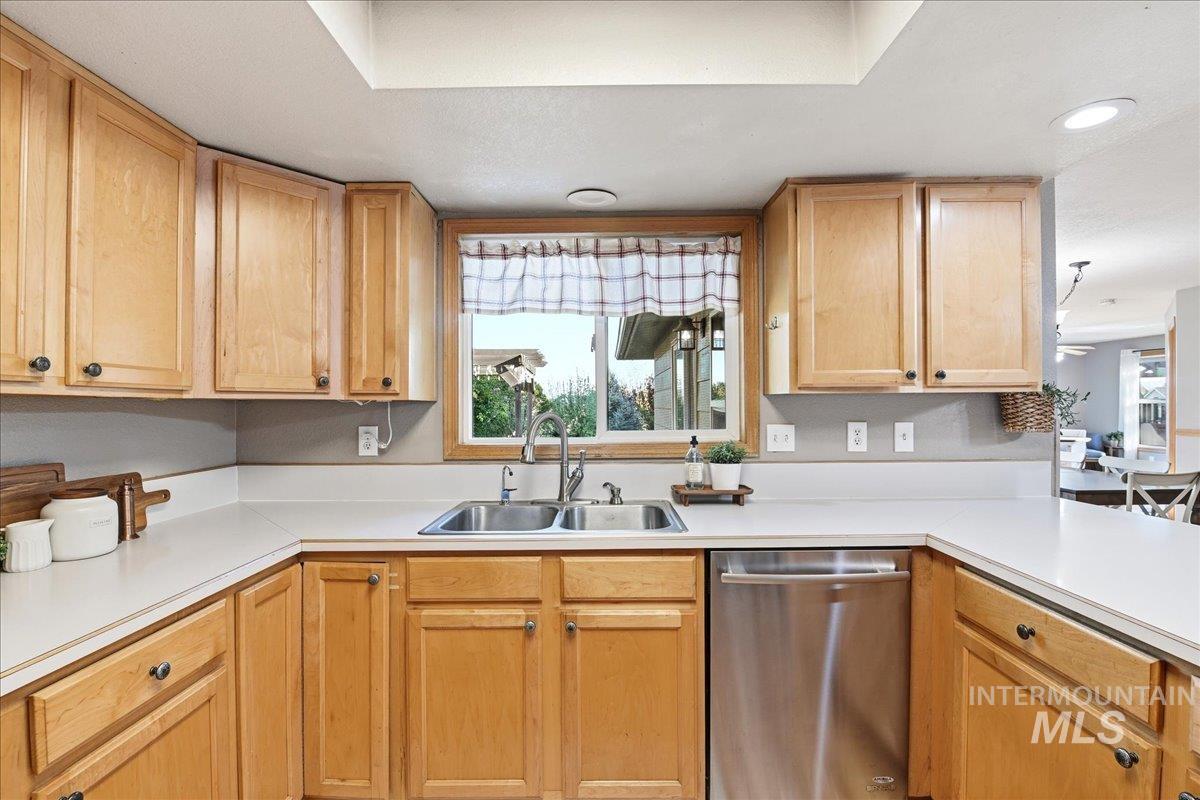 11842 Tioga Street Boise, ID 83709 - Photo 11 of 50 Kitchen featuring a double basin stainless steel sink, light wood cabinetry, recessed lighting, and a stainless steel dishwasher