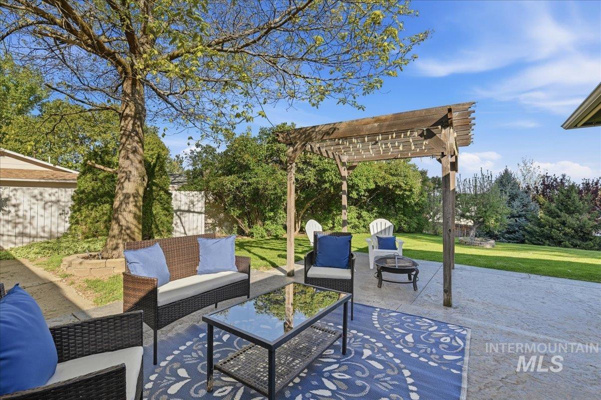 11842 Tioga Street Boise, ID 83709 - Photo 17 of 50 Spacious concrete patio featuring a wooden pergola