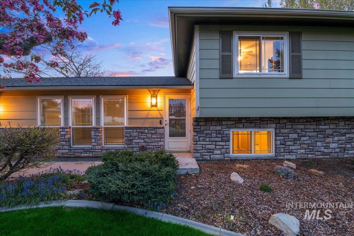 11842 Tioga Street Boise, ID 83709 - Photo 41 of 50 Split-level residence featuring a stone-clad foundation and horizontal siding
