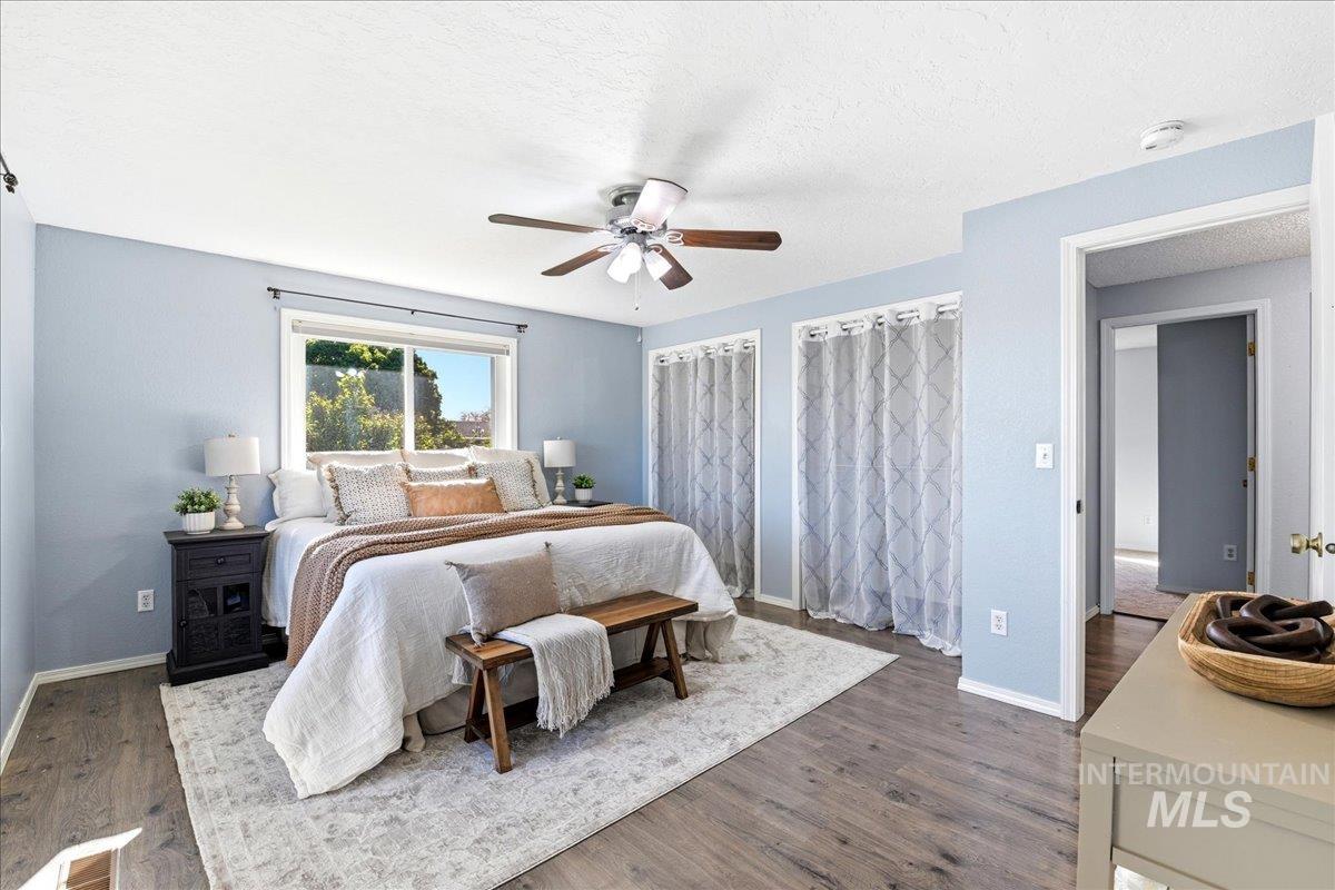11842 Tioga Street Boise, ID 83709 - Photo 8 of 50 Bedroom featuring wood-finish flooring, a ceiling fan, and a large window