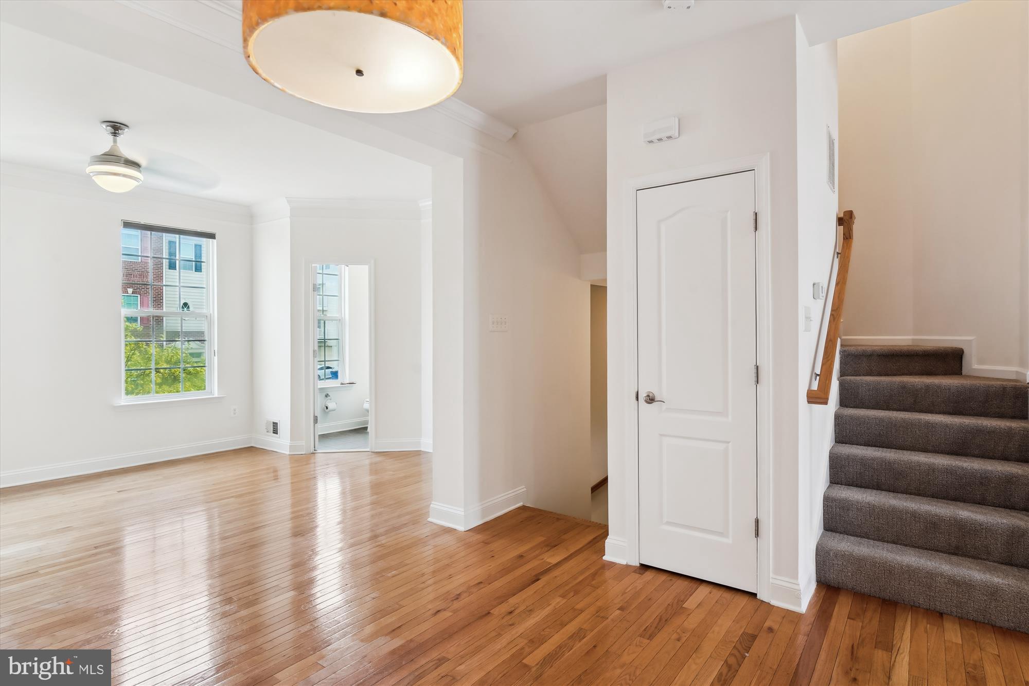2607 Egret Way Frederick, MD 21701 - Photo 11 of 42 an empty room with wooden floor and windows