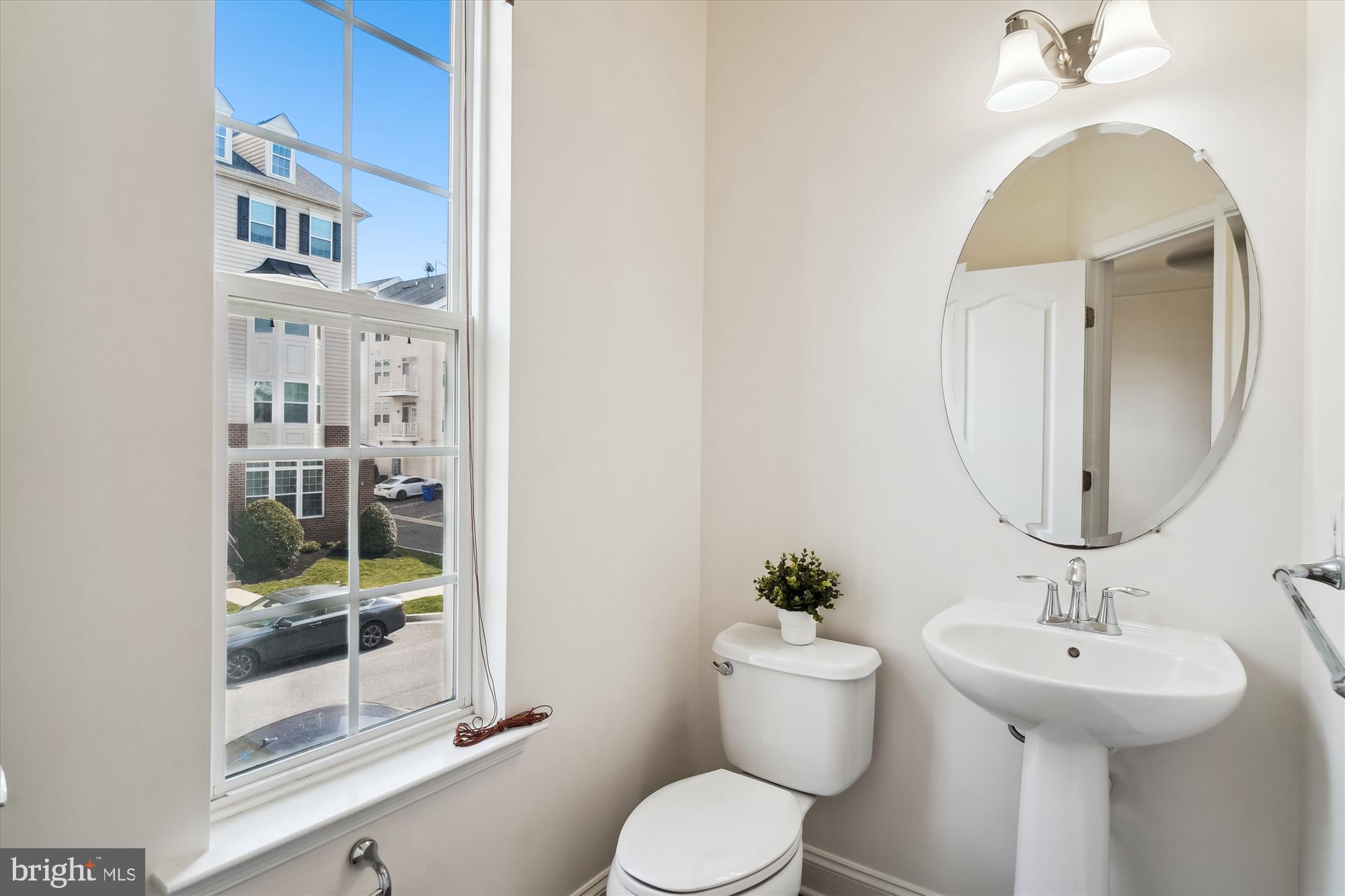 2607 Egret Way Frederick, MD 21701 - Photo 15 of 42 a bathroom with a toilet sink and mirror