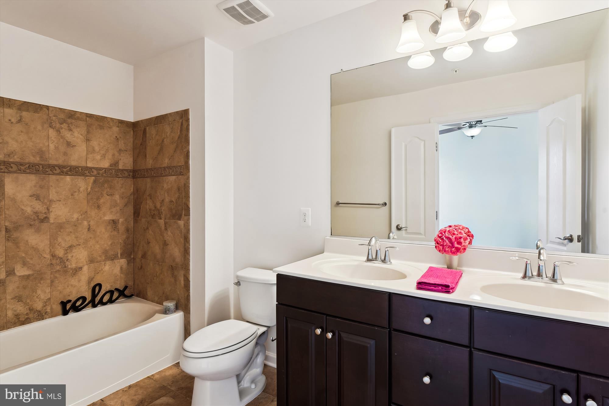 2607 Egret Way Frederick, MD 21701 - Photo 20 of 42 a bathroom with a double vanity sink mirror and toilet