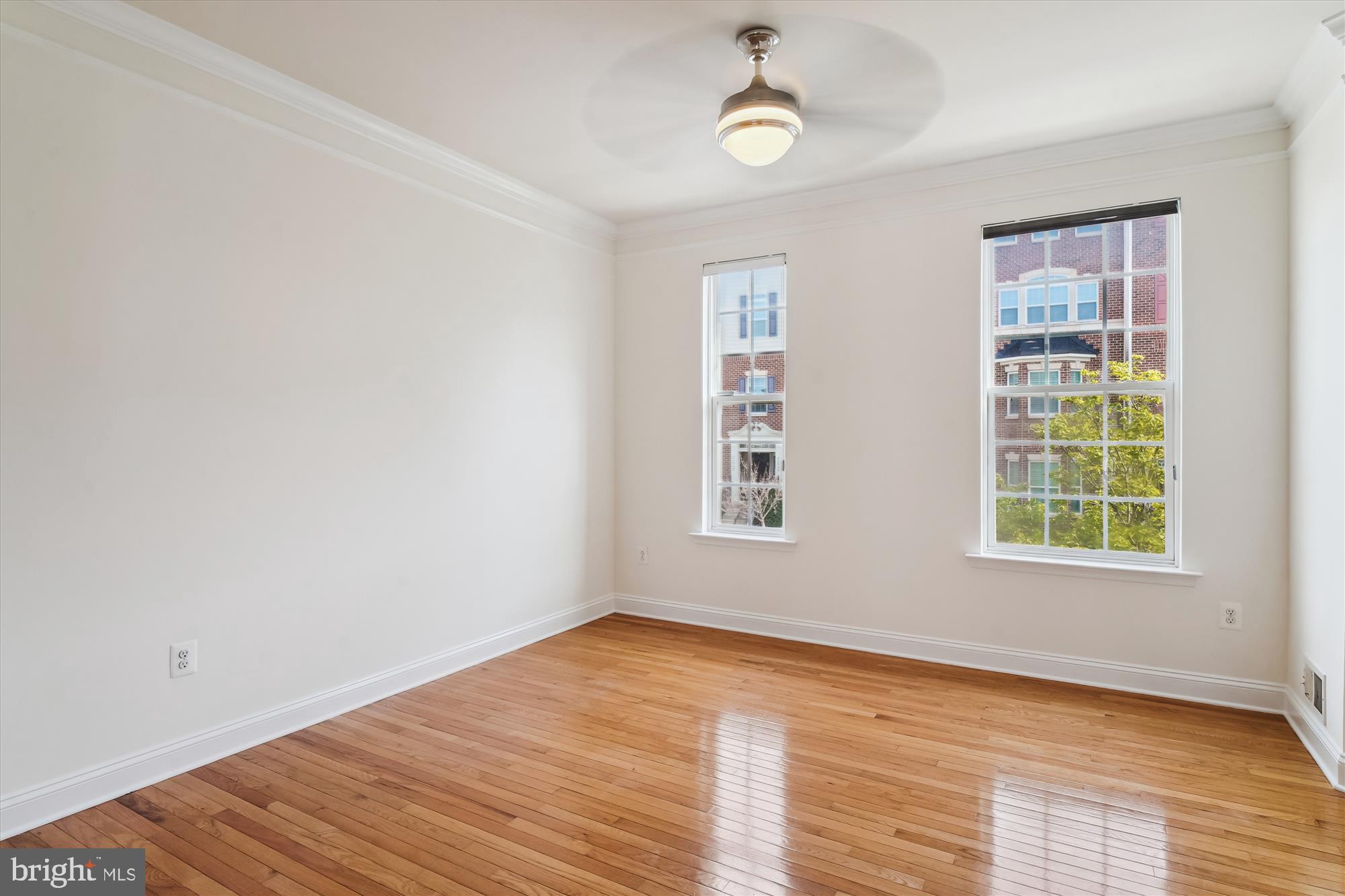 2607 Egret Way Frederick, MD 21701 - Photo 3 of 42 an empty room with wooden floor and windows