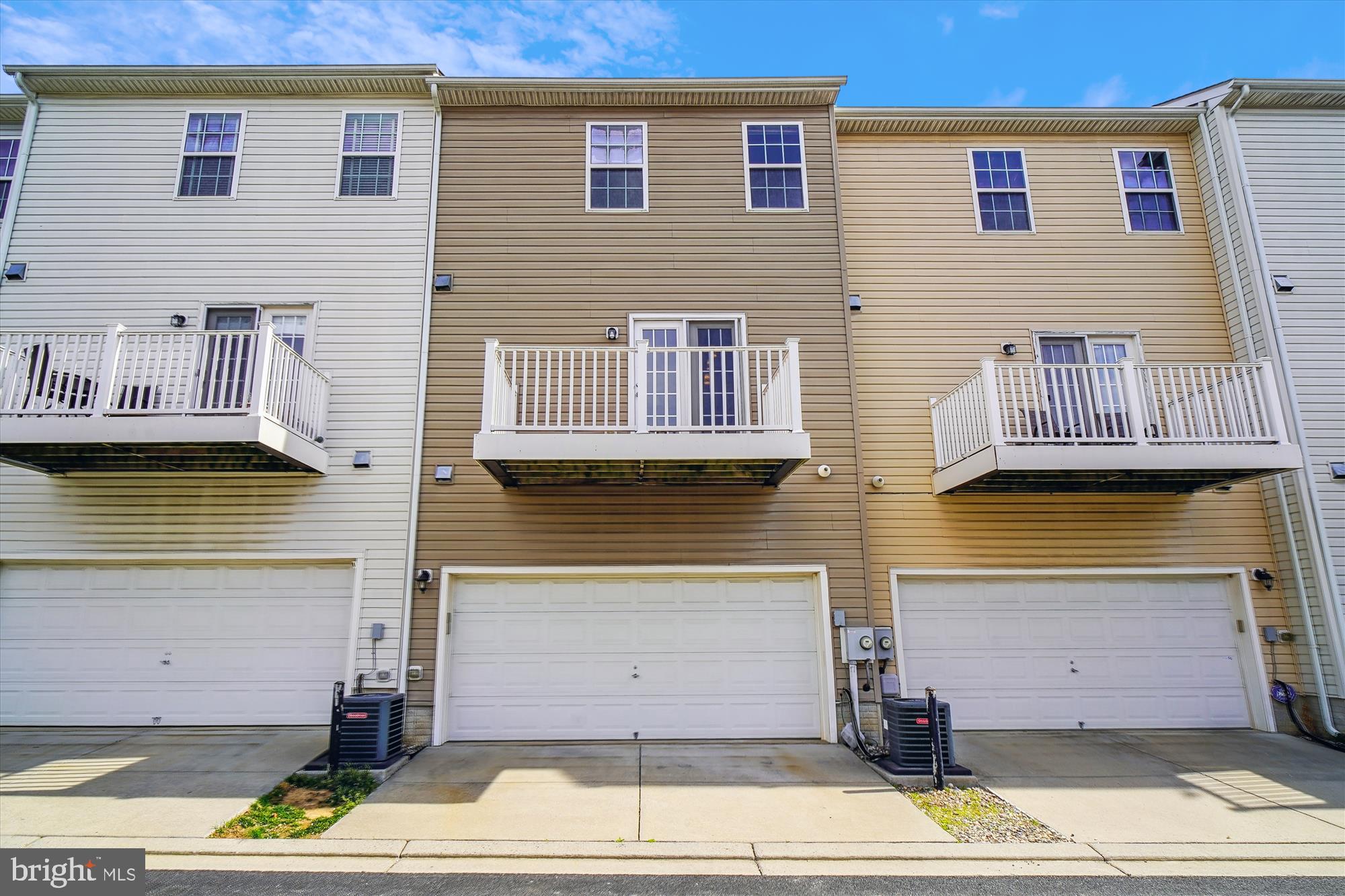 2607 Egret Way Frederick, MD 21701 - Photo 32 of 42 a front view of a house with a garden and parking