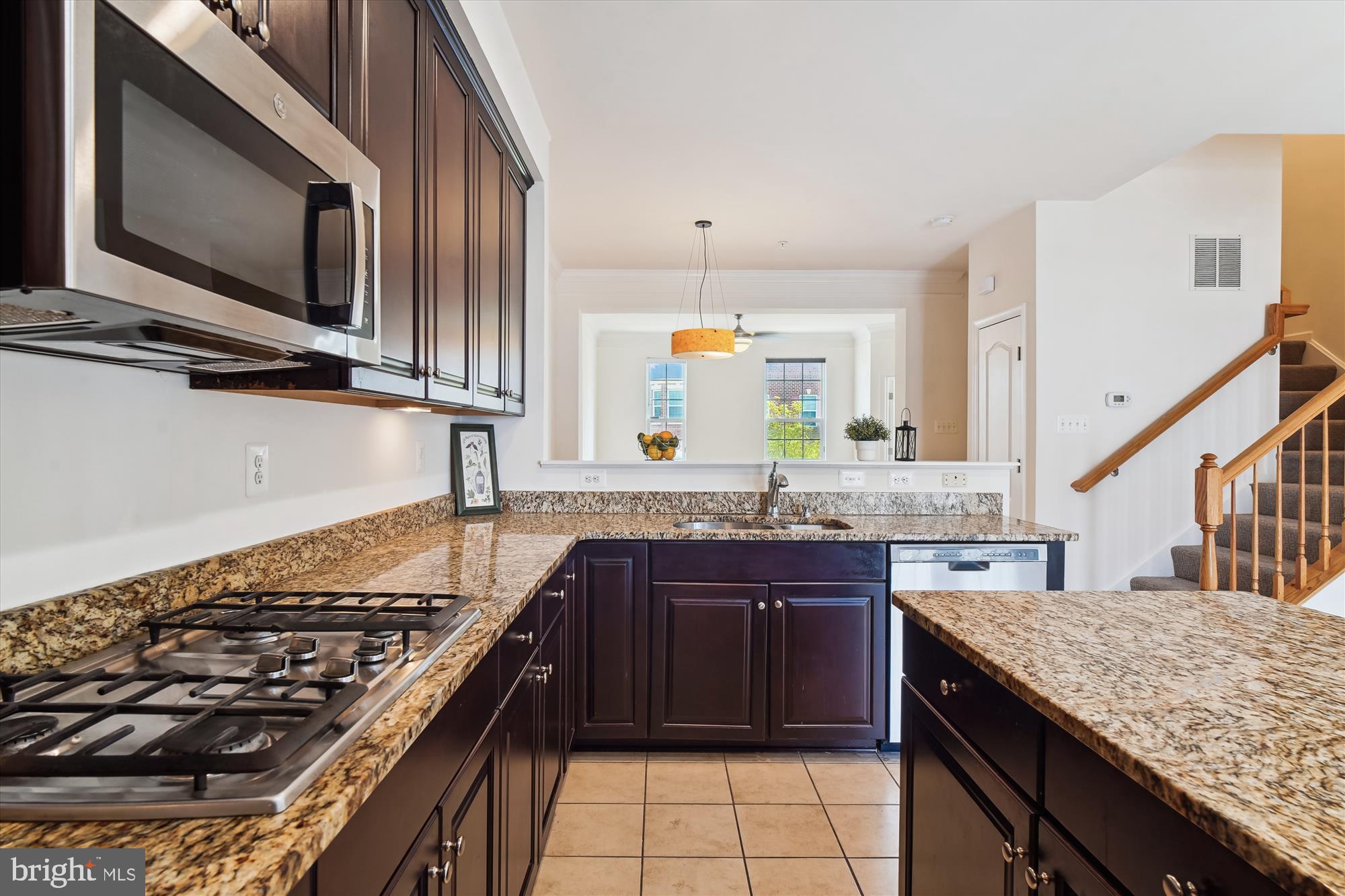 2607 Egret Way Frederick, MD 21701 - Photo 7 of 42 a kitchen with stainless steel appliances granite countertop a stove and a sink
