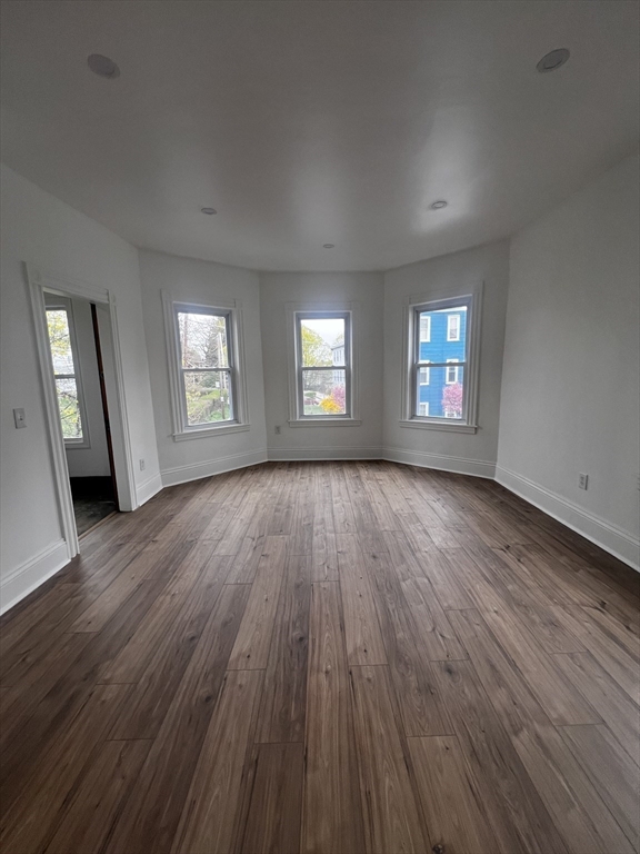 19 Reeves Street Worcester, MA 01607 - Photo 13 of 30 a view of an empty room with wooden floor and window