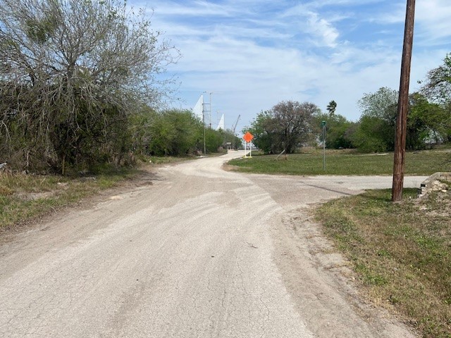 1404 Frank Street Corpus Christi, TX 78401 - Photo 2 of 2 a view of dirt yard with large trees