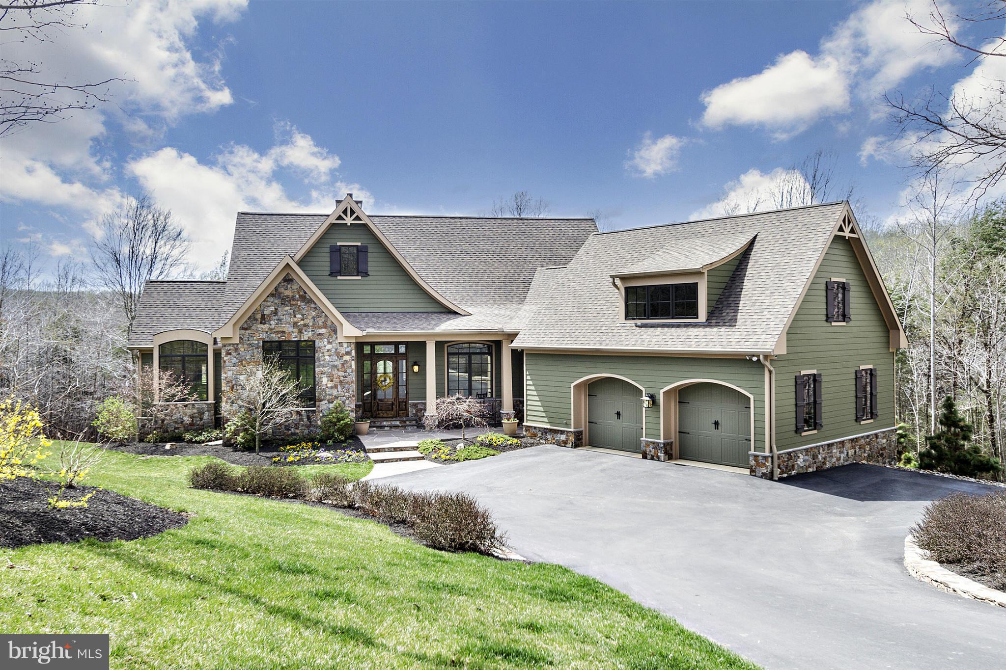 a front view of a house with garden and porch