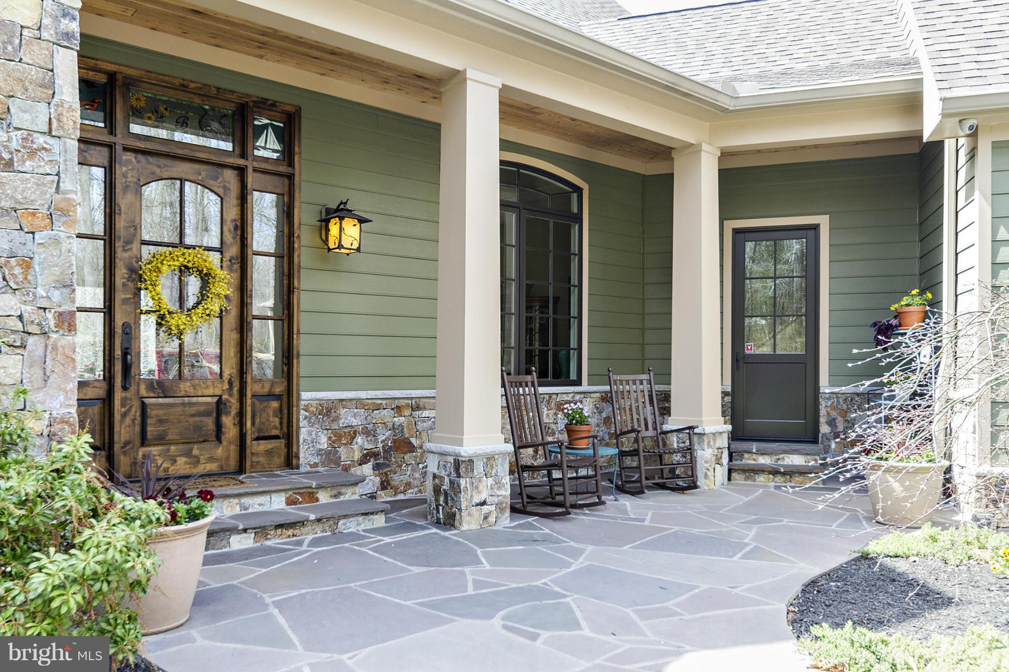 13001 Wainwright Road Highland, MD 20777 - Photo 2 of 30 a view of front door of house with outdoor seating