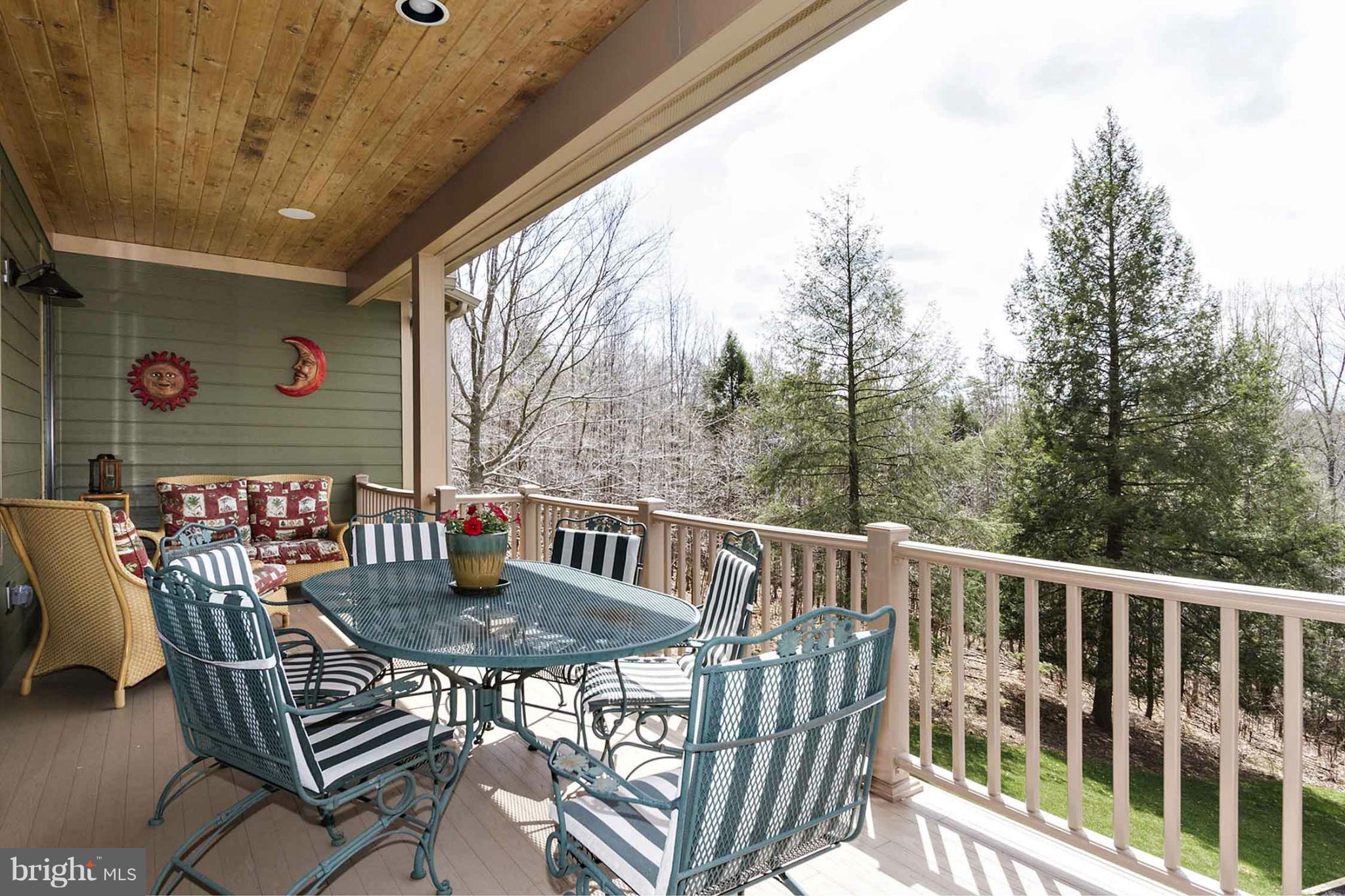 13001 Wainwright Road Highland, MD 20777 - Photo 11 of 30 a view of a chairs and table in the balcony