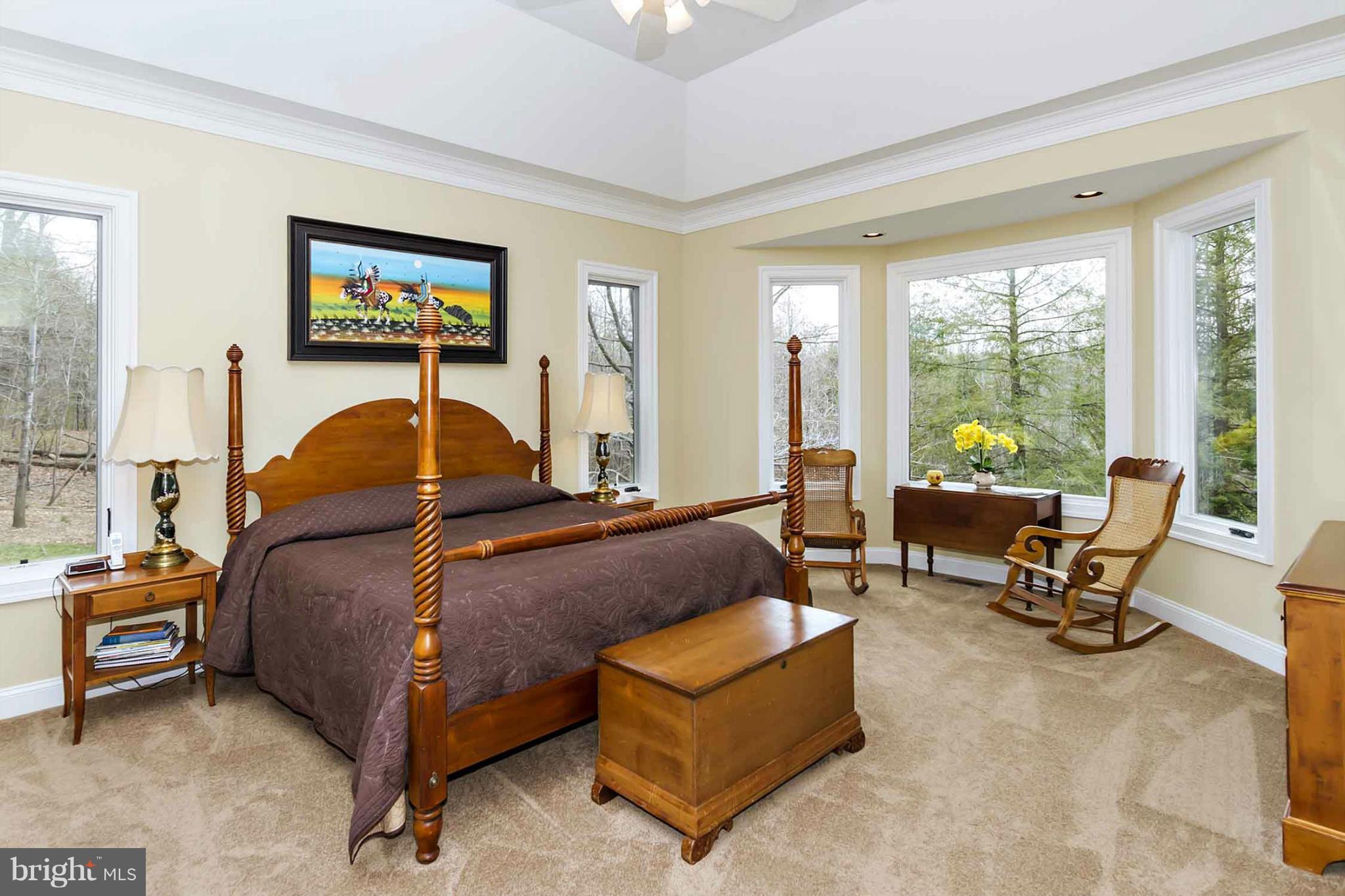 13001 Wainwright Road Highland, MD 20777 - Photo 13 of 30 a bedroom with a bed and a couch