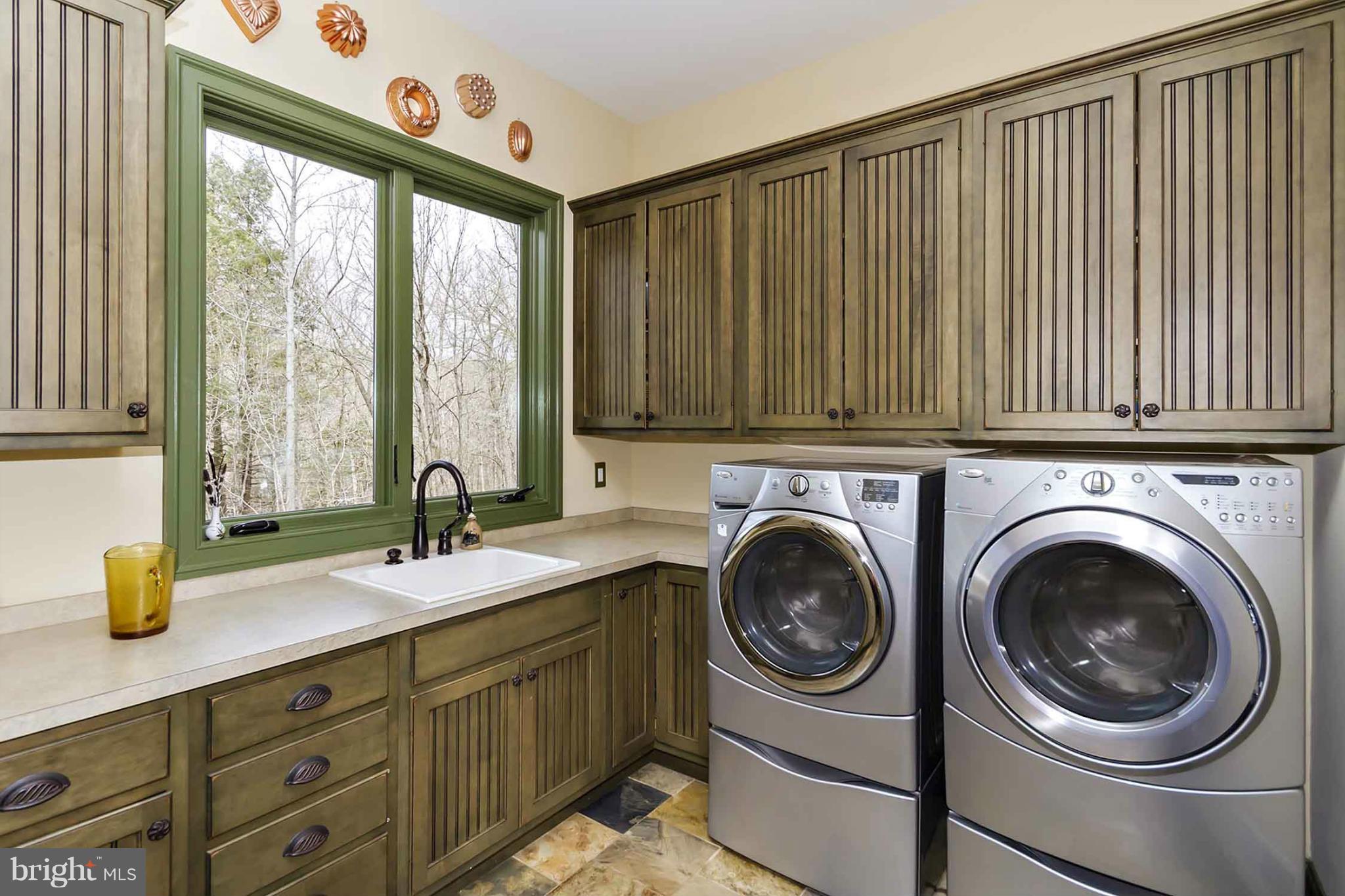 13001 Wainwright Road Highland, MD 20777 - Photo 17 of 30 a utility room with sink dryer and washer
