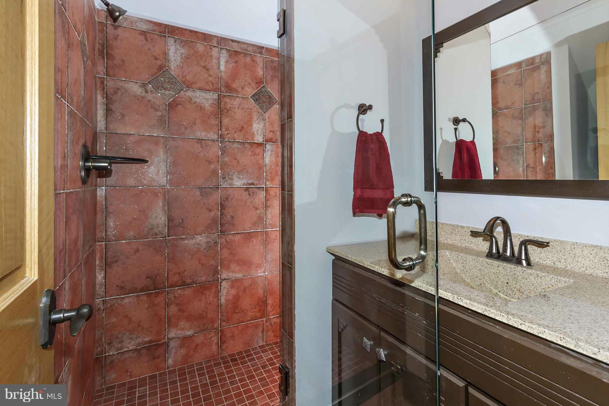 13001 Wainwright Road Highland, MD 20777 - Photo 19 of 30 a bathroom with a sink and a mirror