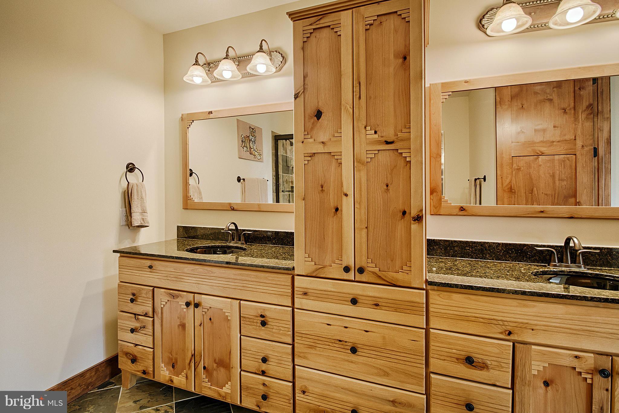 13001 Wainwright Road Highland, MD 20777 - Photo 24 of 30 a bathroom with a granite countertop sink mirror and
