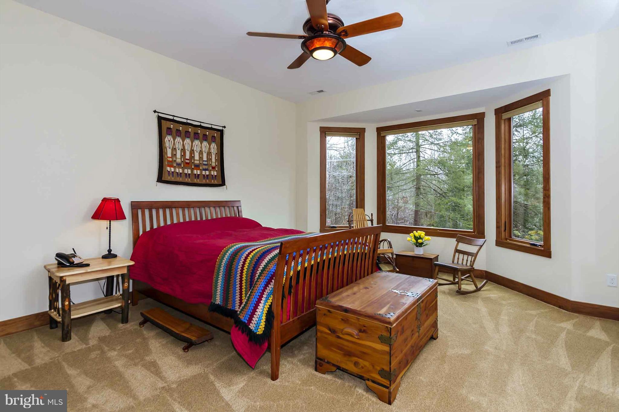 13001 Wainwright Road Highland, MD 20777 - Photo 25 of 30 a bedroom with a bed and a window