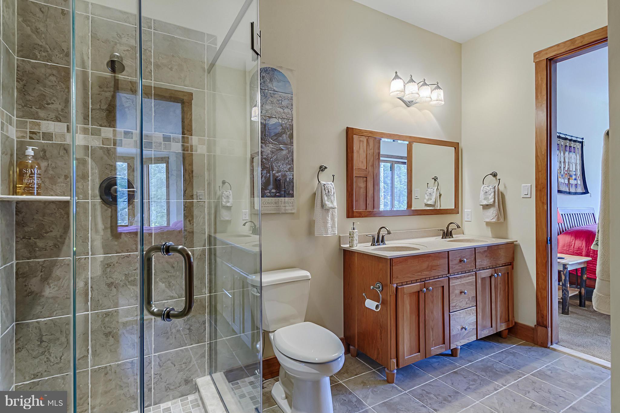13001 Wainwright Road Highland, MD 20777 - Photo 26 of 30 a bathroom with a toilet sink and mirror