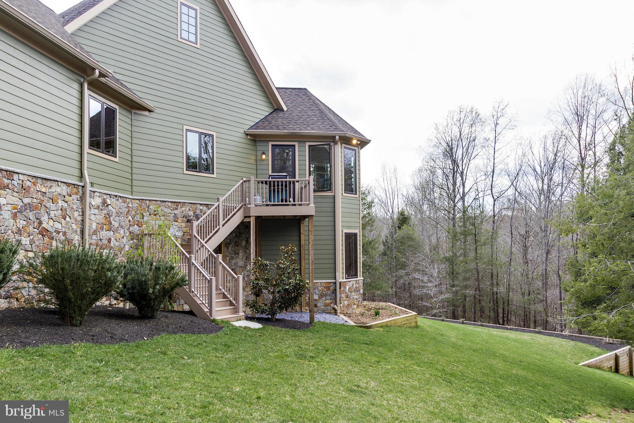 13001 Wainwright Road Highland, MD 20777 - Photo 29 of 30 a view of a house with a yard and sitting area