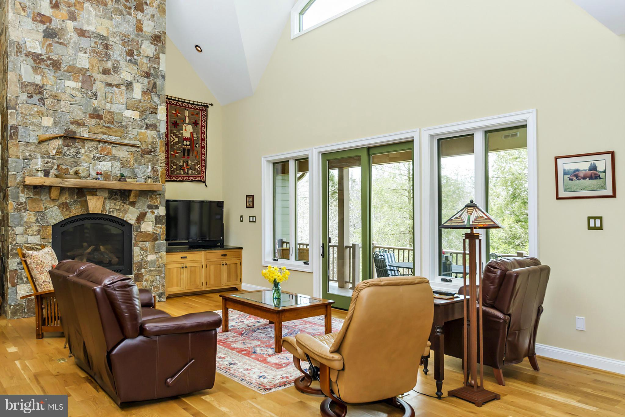 13001 Wainwright Road Highland, MD 20777 - Photo 6 of 30 a living room with furniture and a fireplace