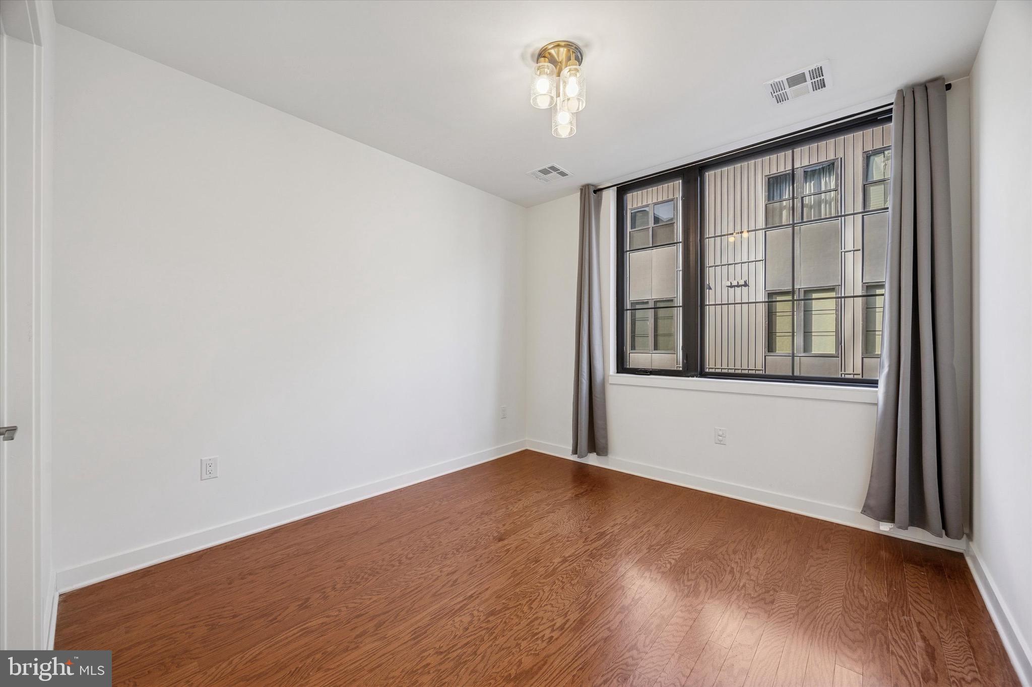 4548 Riverside Way Philadelphia, PA 19127 - Photo 3 of 5 a view of an empty room with a window