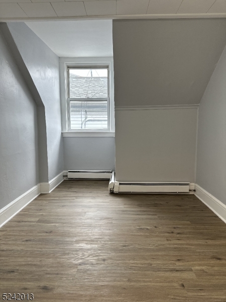 1032 Olive Street, Unit 3 Elizabeth, NJ 07201 - Photo 3 of 9 a view of a room with wooden floor and window