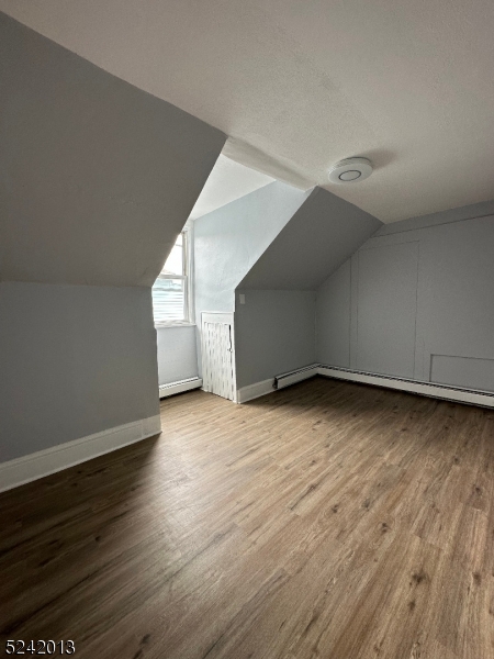 1032 Olive Street, Unit 3 Elizabeth, NJ 07201 - Photo 5 of 9 a view of a big room with wooden floor and windows