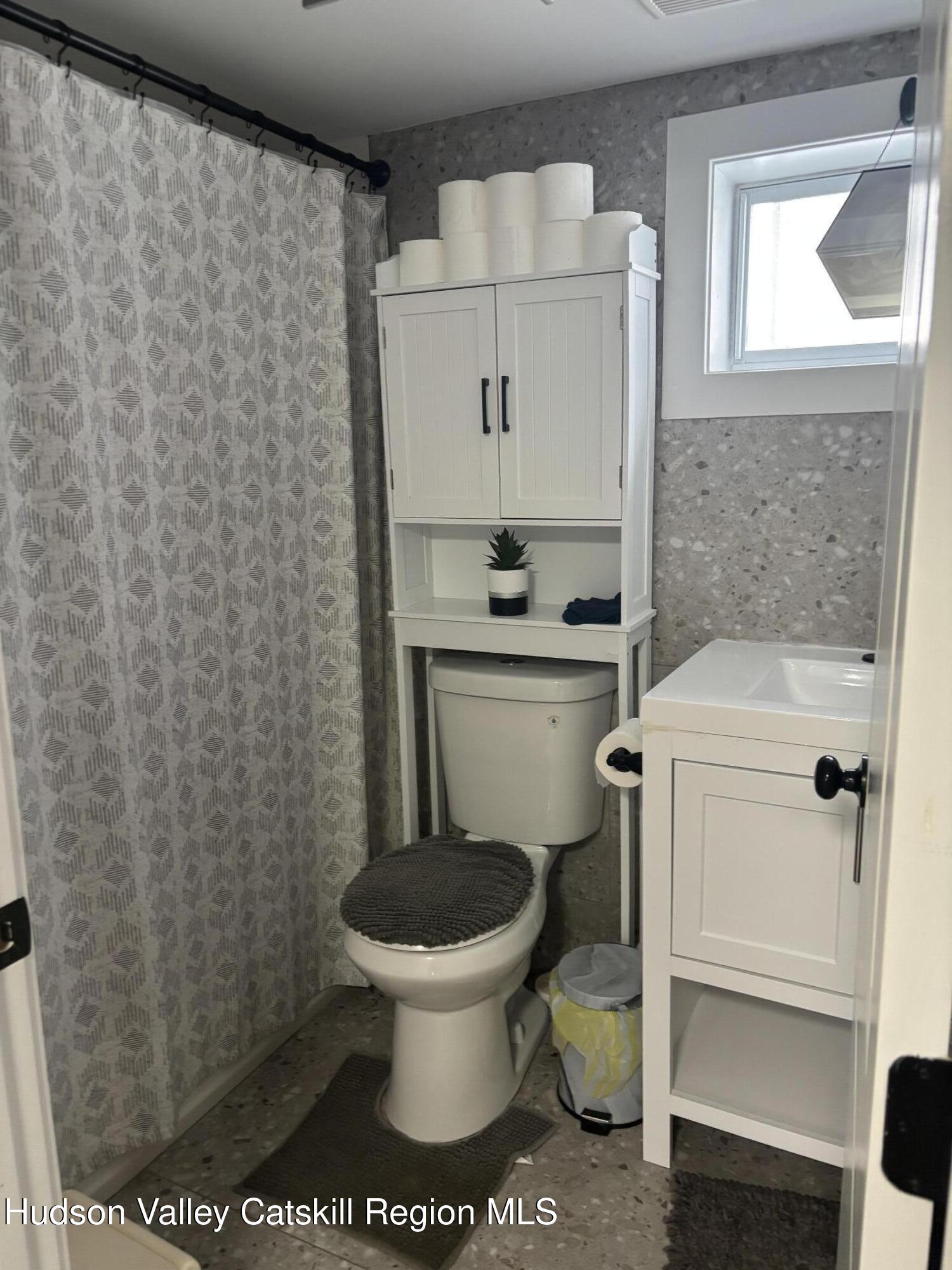 83 Marple Rd Extension Poughkeepsie, NY 12603 - Photo 15 of 23 a bathroom with a toilet and a sink