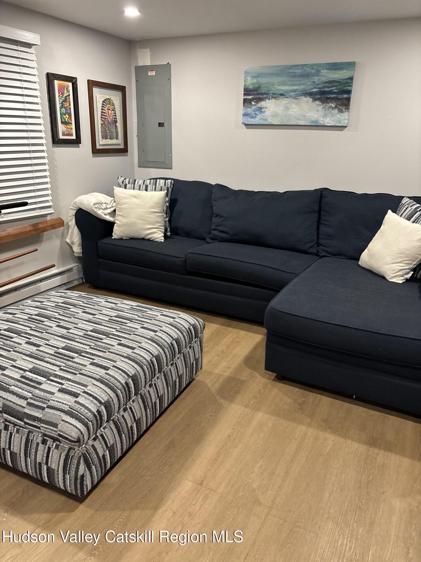 83 Marple Rd Extension Poughkeepsie, NY 12603 - Photo 17 of 23 a living room with furniture and painting on the wall