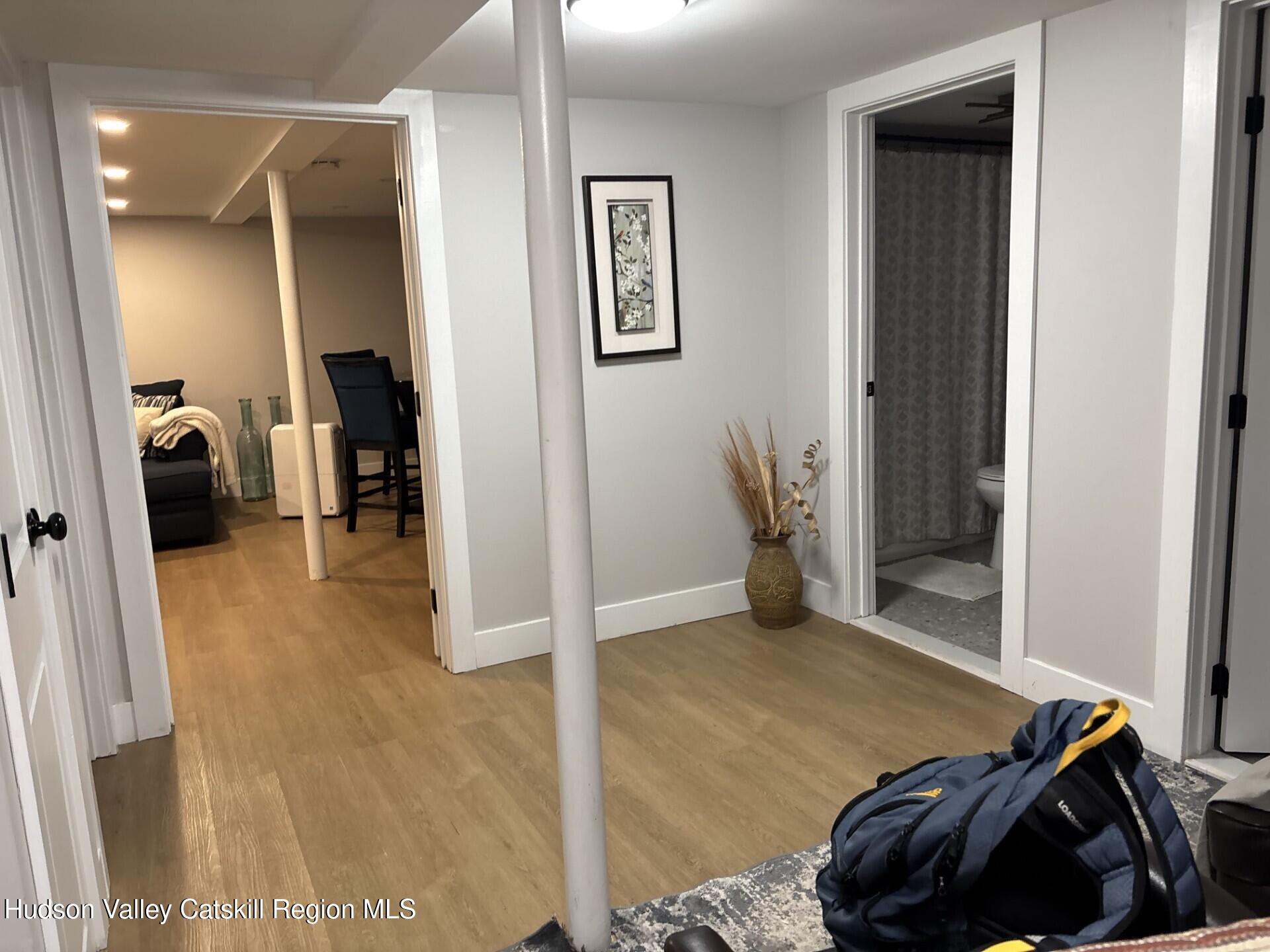 83 Marple Rd Extension Poughkeepsie, NY 12603 - Photo 18 of 23 a bedroom with a bed and a walk in closet