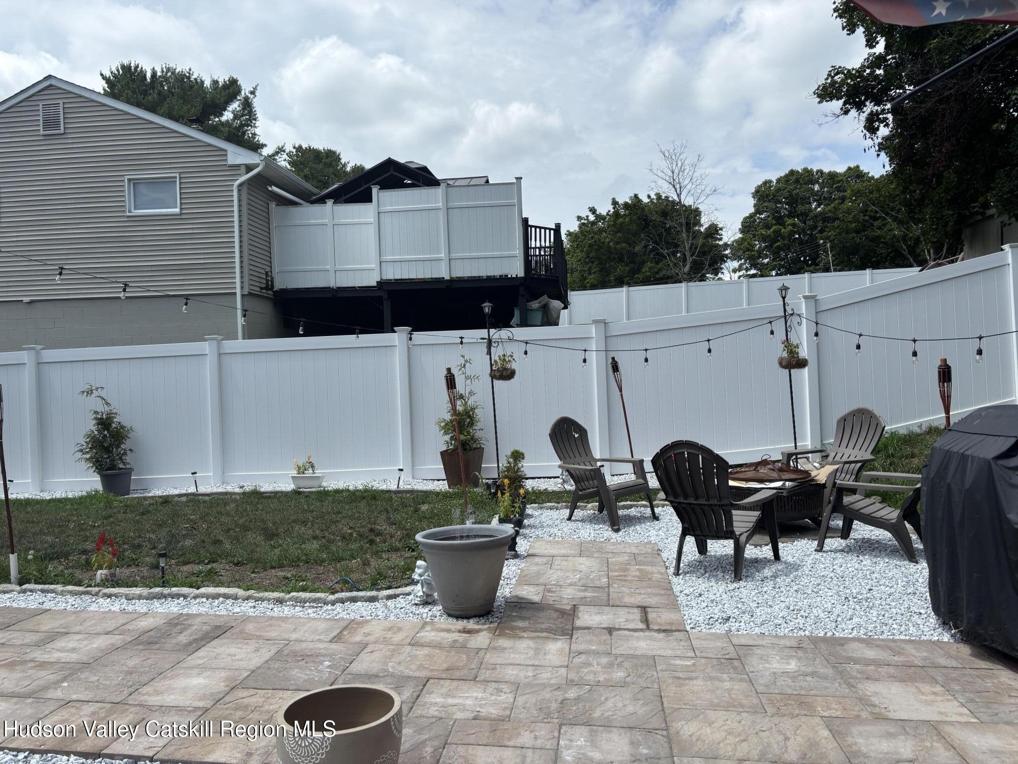 83 Marple Rd Extension Poughkeepsie, NY 12603 - Photo 21 of 23 a view of a patio with table and chairs