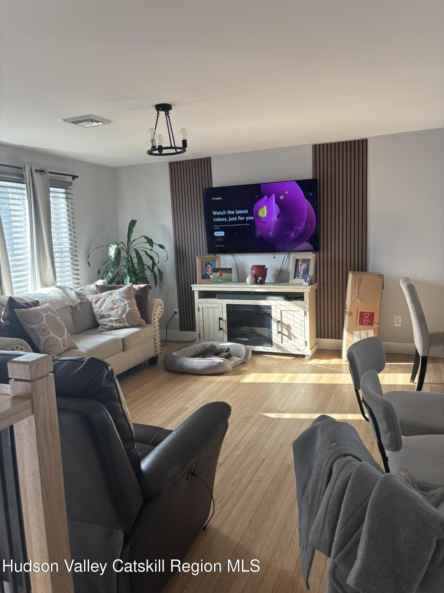 83 Marple Rd Extension Poughkeepsie, NY 12603 - Photo 4 of 23 a living room with furniture and a flat screen tv