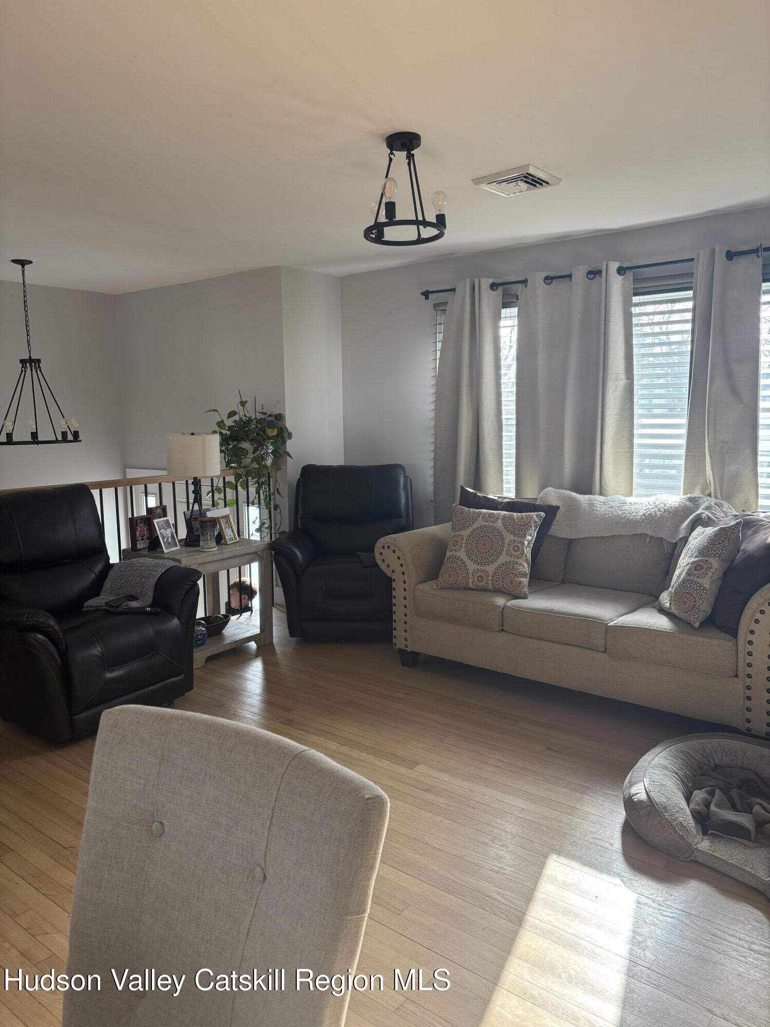 83 Marple Rd Extension Poughkeepsie, NY 12603 - Photo 5 of 23 a living room with furniture and a large window