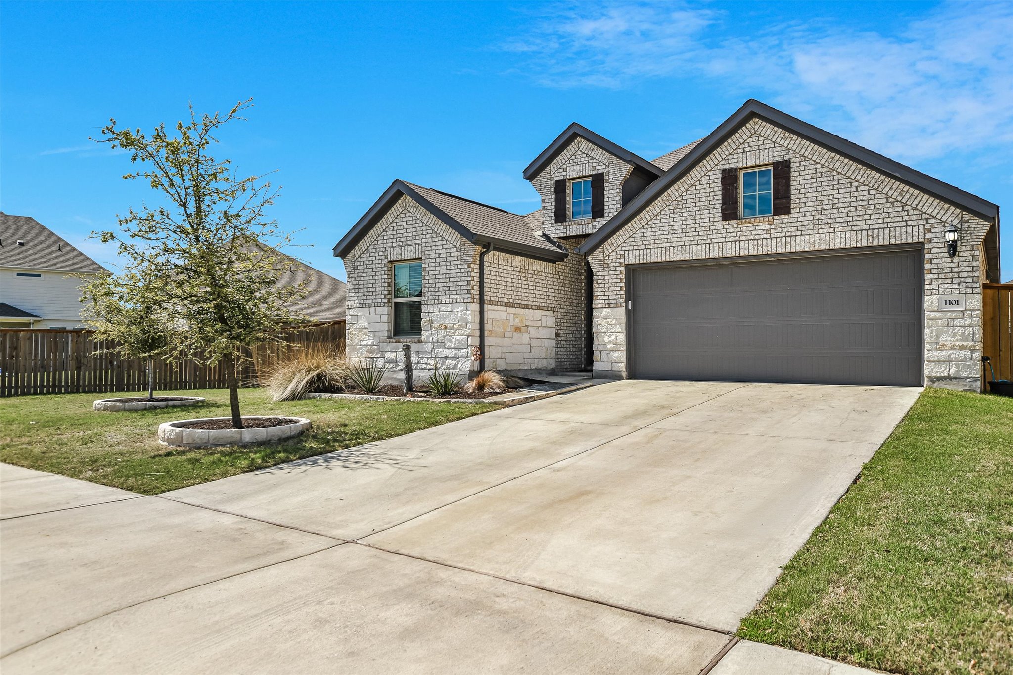 1101 Terrace View Drive Georgetown, TX 78628 - Photo 2 of 20 French country inspired facade with stone siding, driveway, and an attached garage
