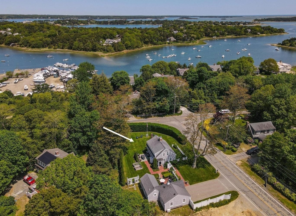 751 Crowell Road Chatham, MA 02650 - Photo 1 of 41 an aerial view of ocean residential house with outdoor space and swimming pool