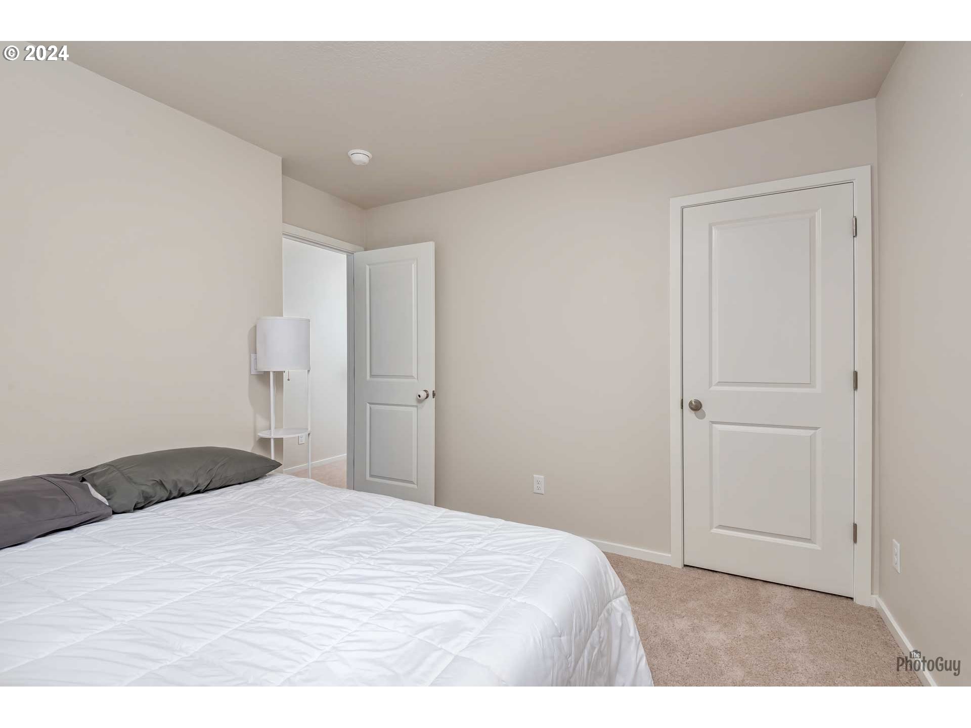 2661 26th Loop Springfield, OR 97477 - Photo 36 of 43 a bedroom with a bed and a cabinets