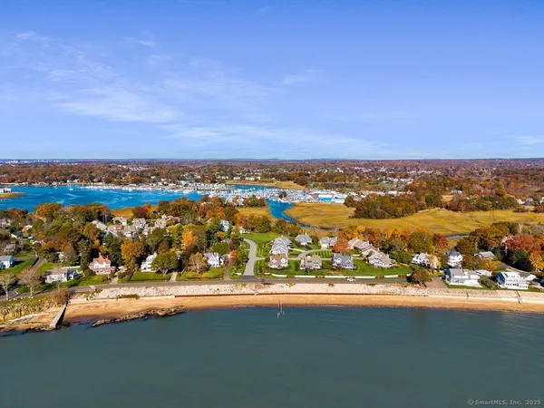 an aerial view of residential building with ocean view