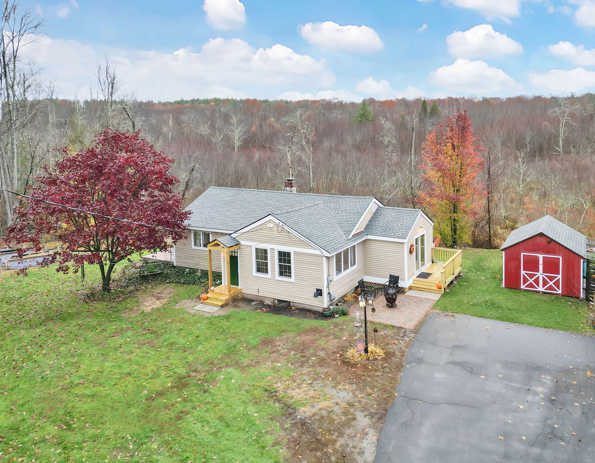 44 Strong Road Granby, CT 06090 - Photo 1 of 1 an aerial view of residential houses and trees in the background