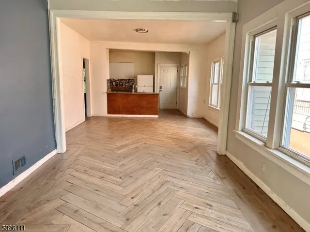 a view of a bathroom with a sink and a mirror
