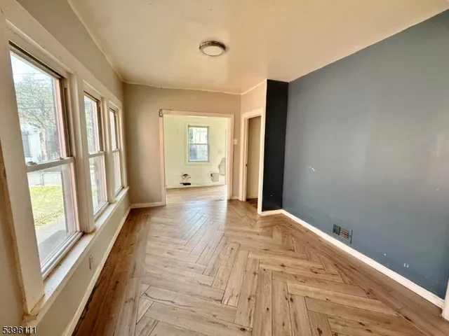 a view of empty room with windows